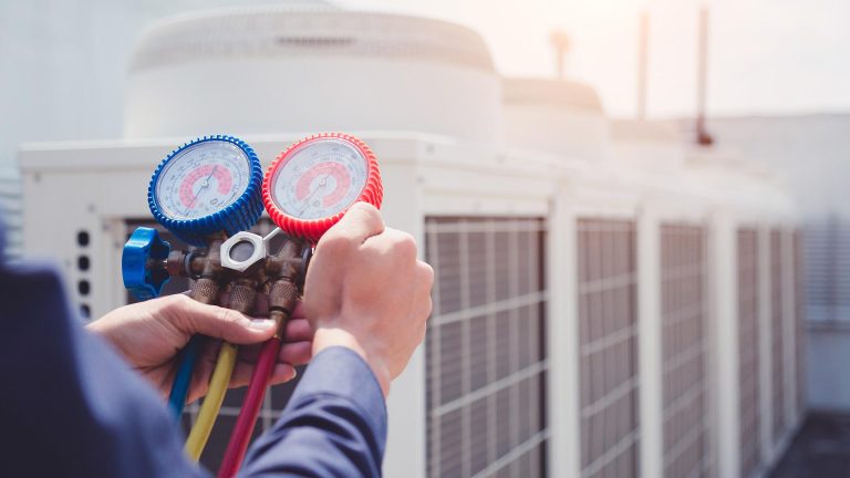 hvac-technician-hands-with-tool-close-up-repairing-units-at-commercial-building-collinsville-il.jpg